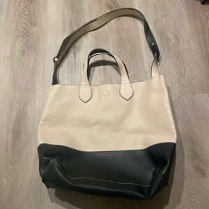 Black and white leather purse with metal clasp